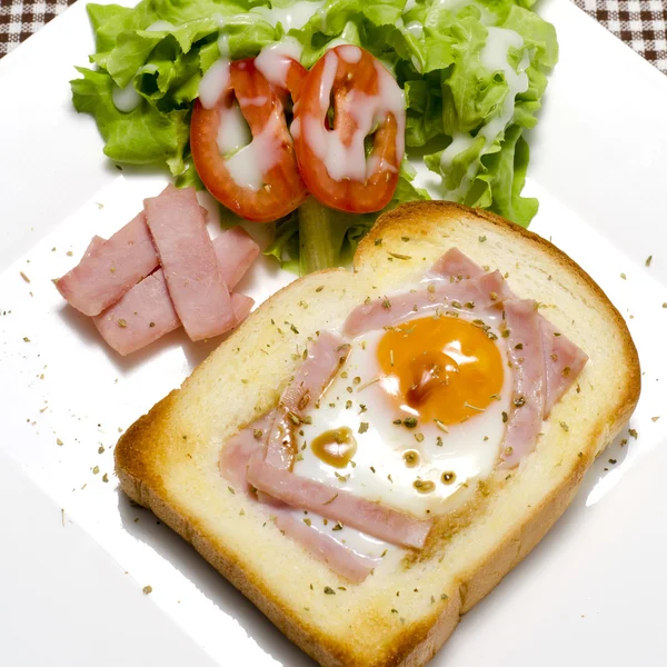 Breakfast egg in a hole — Stock Photo, Image