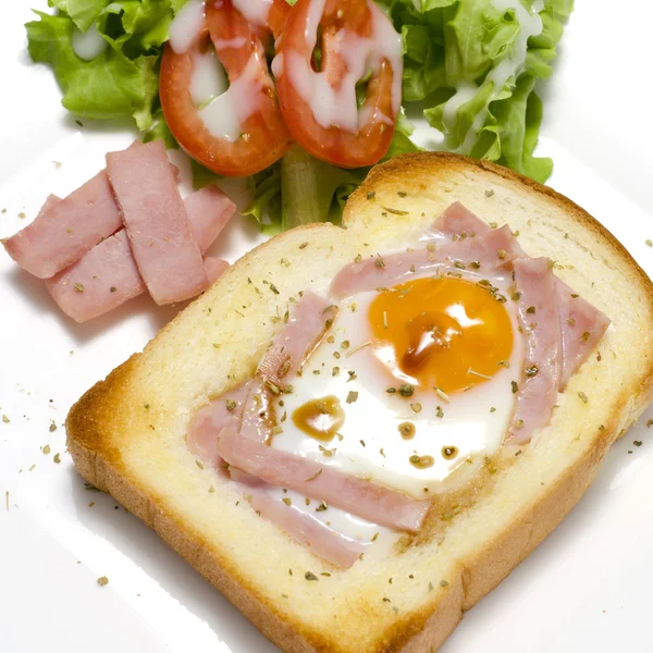 Breakfast egg in a hole — Stock Photo, Image