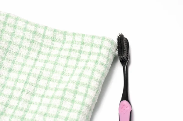 Tooth brush and towel — Stock Photo, Image