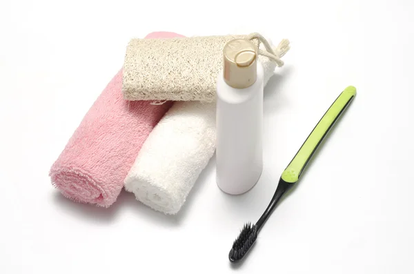 Serviette loofah savon liquide et brosse à dents — Photo