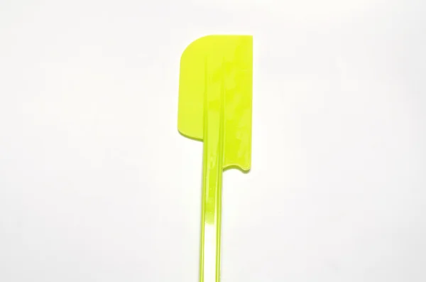 Green plastic spatula — Stock Photo, Image