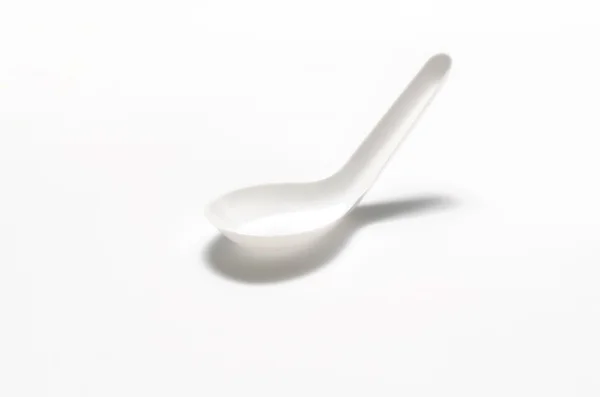 White plastic spoon — Stock Photo, Image