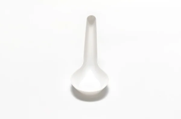 Biały łyżka z tworzywa sztucznego — Zdjęcie stockowe
