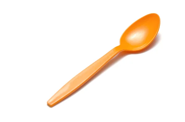 Orange plastic spoon — Stock Photo, Image