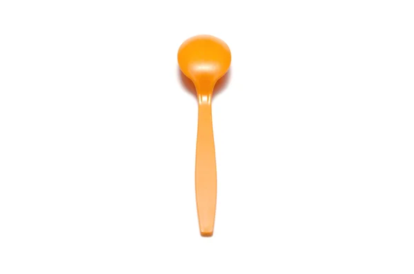 Pomarańczowy łyżka z tworzywa sztucznego — Zdjęcie stockowe