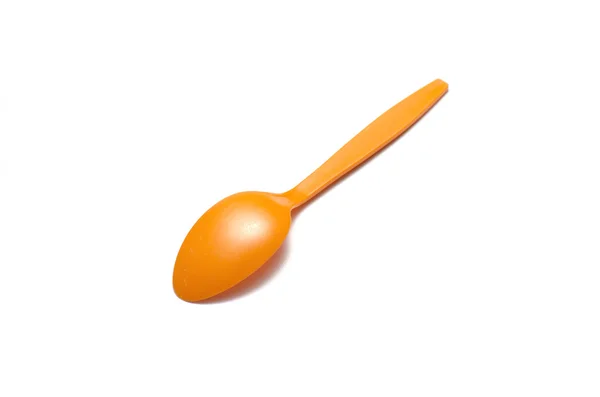 Orange plastic spoon — Stock Photo, Image