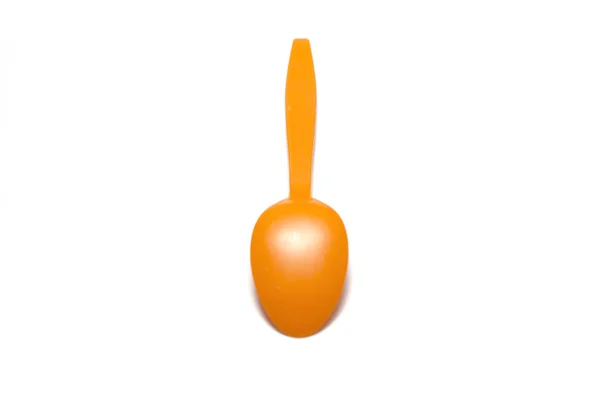 Orange plastic spoon — Stock Photo, Image