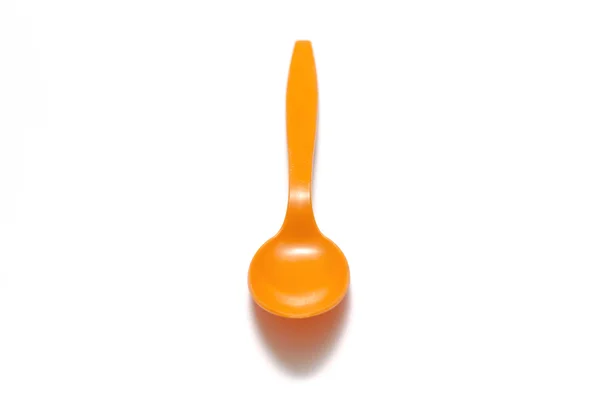 Colher de plástico laranja — Fotografia de Stock