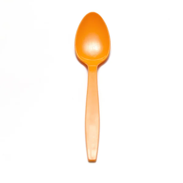 Orange plastic spoon — Stock Photo, Image