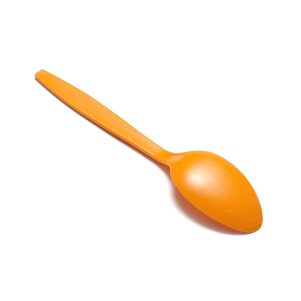 Oranje plastic lepel — Stockfoto