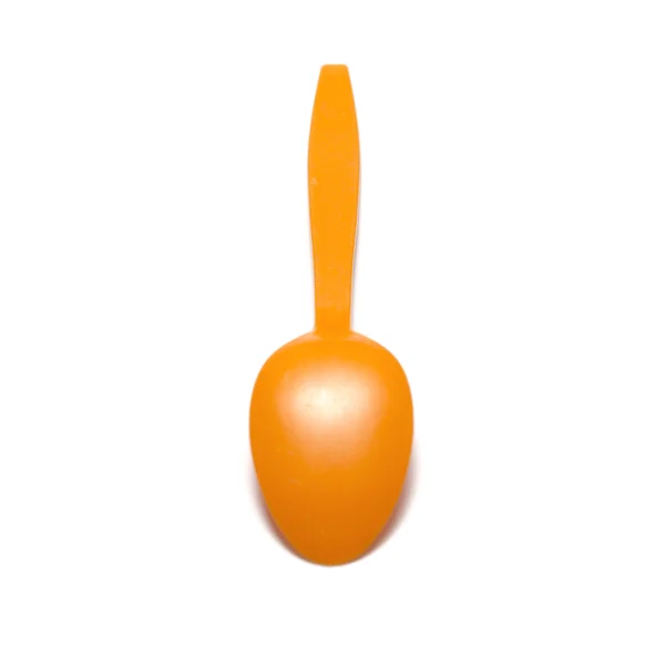 Oranje plastic lepel — Stockfoto