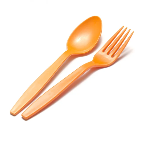 Löffel und Gabel aus orangefarbenem Kunststoff — Stockfoto