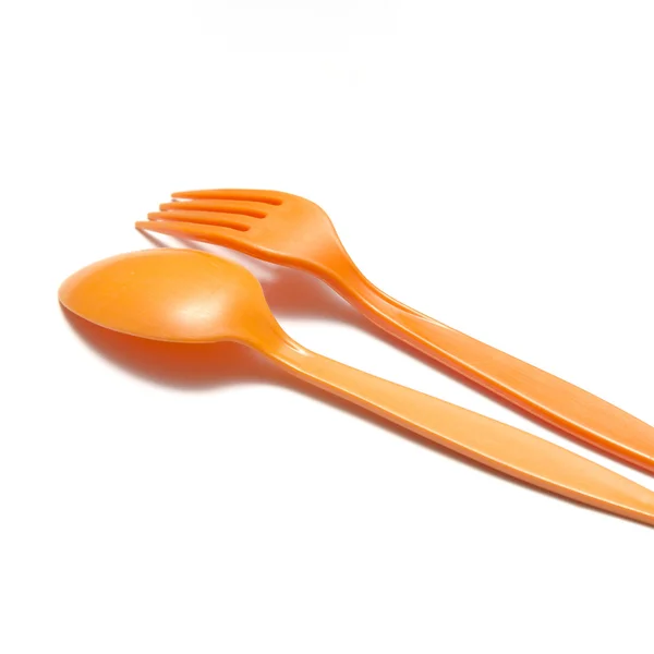 Löffel und Gabel aus orangefarbenem Kunststoff — Stockfoto