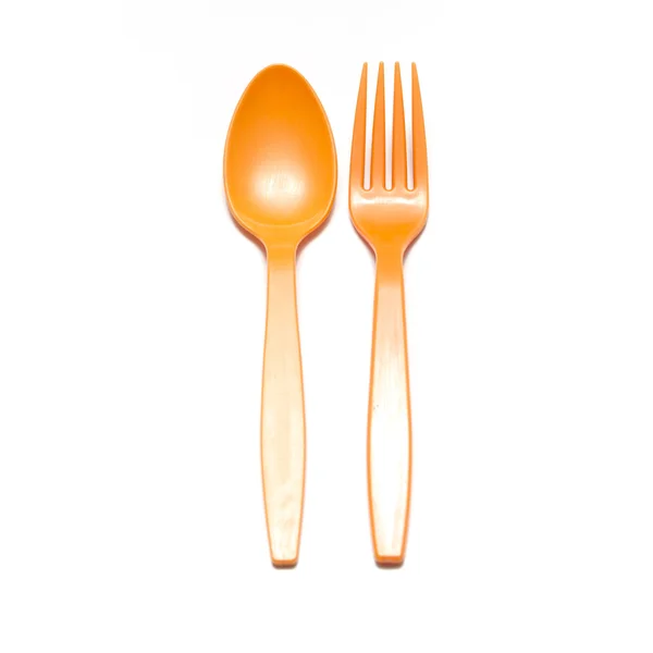 Orange plastic spoon and fork — Stock Photo, Image