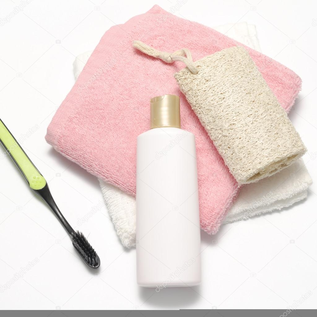 Towel loofah liquid soap and toothbrush