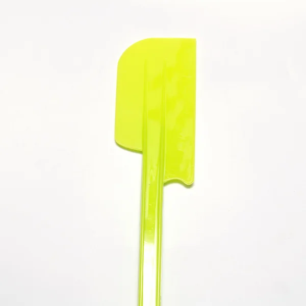 Green plastic spatula — Stock Photo, Image