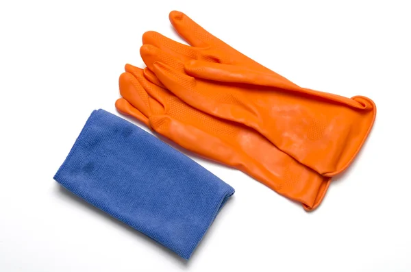 Blauwe lap met oranje schoonmaken handschoenen — Stockfoto