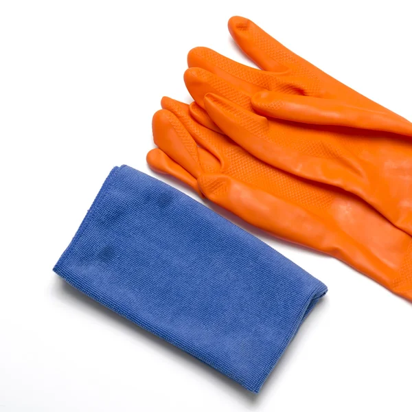Blauwe lap met oranje schoonmaken handschoenen — Stockfoto