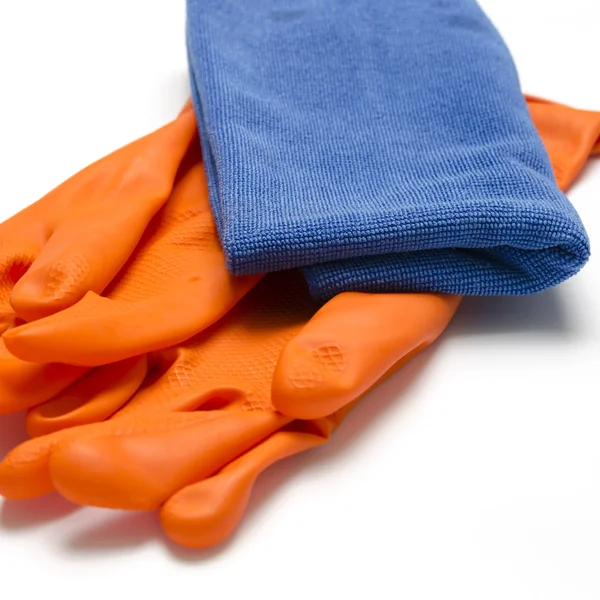 Blauwe lap met oranje schoonmaken handschoenen — Stockfoto