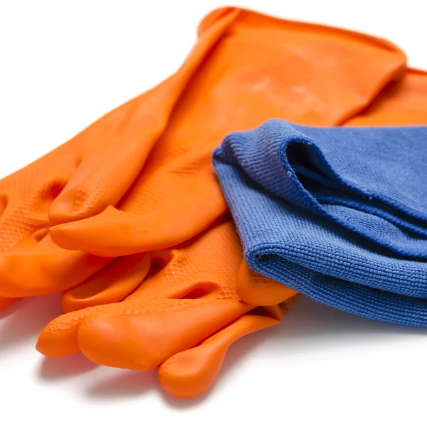 Blauwe lap met oranje schoonmaken handschoenen — Stockfoto