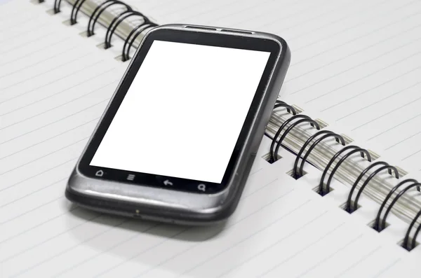 Smartphone no caderno. — Fotografia de Stock