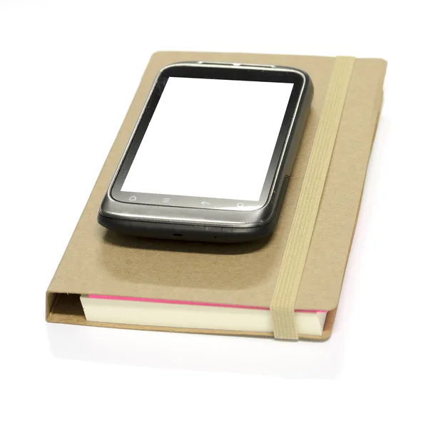 Smartphone en libreta — Foto de Stock