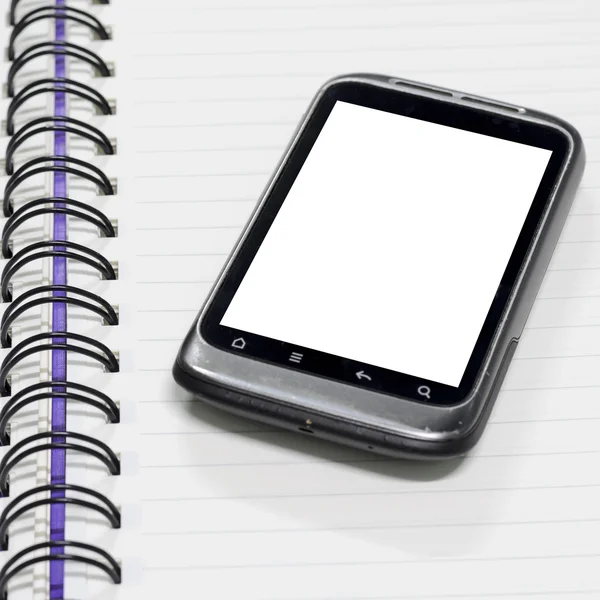 Smartphone no caderno. — Fotografia de Stock