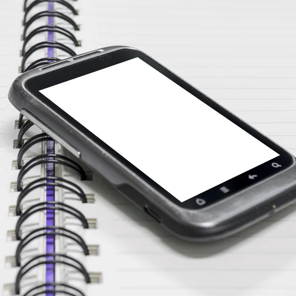 Smartphone no caderno. — Fotografia de Stock