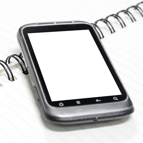 Smartphone no caderno. — Fotografia de Stock