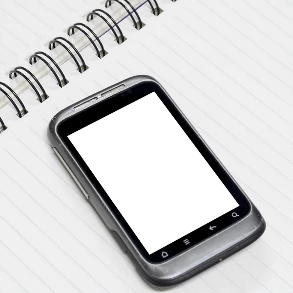 Smartphone on note book — Stock Photo, Image