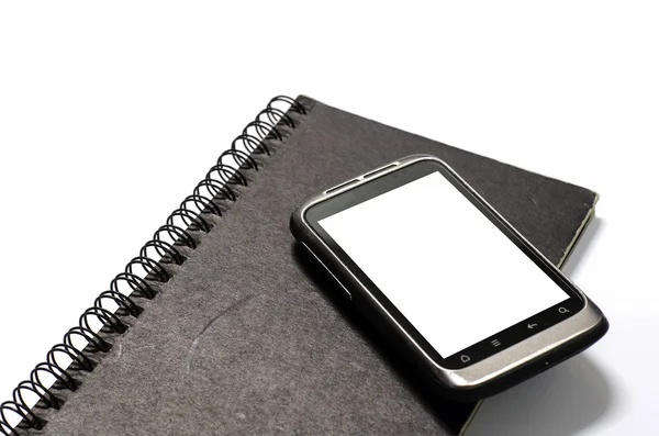 Smartphone no caderno. — Fotografia de Stock