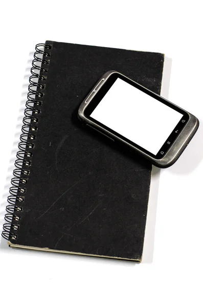 Smartphone on note book — Stock Photo, Image