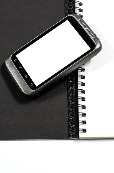 Smartphone no caderno. — Fotografia de Stock