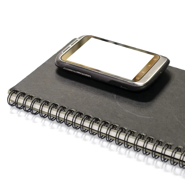 Smartphone on note book — Stock Photo, Image