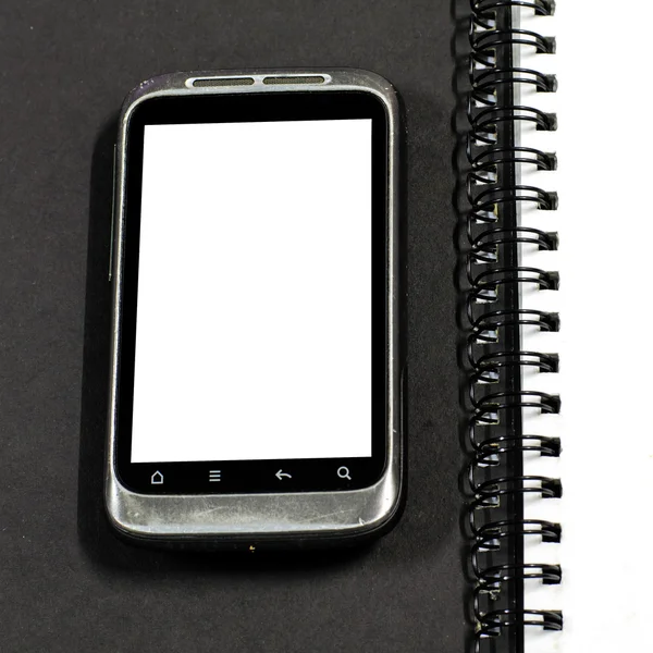 Smartphone no caderno. — Fotografia de Stock