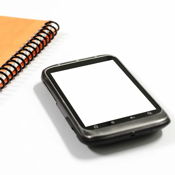 Smartphone com livro de notas — Fotografia de Stock