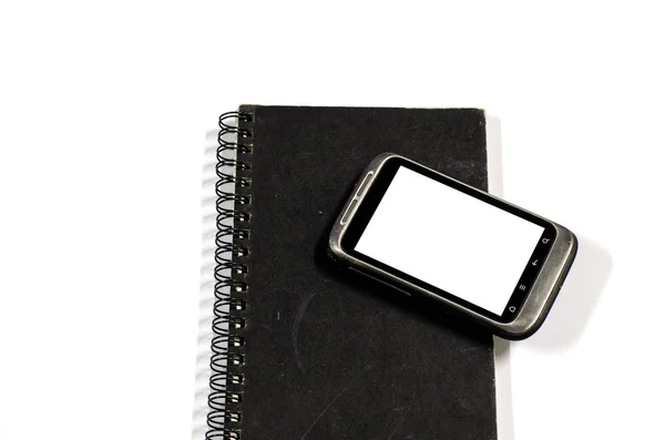 Smartphone no caderno. — Fotografia de Stock