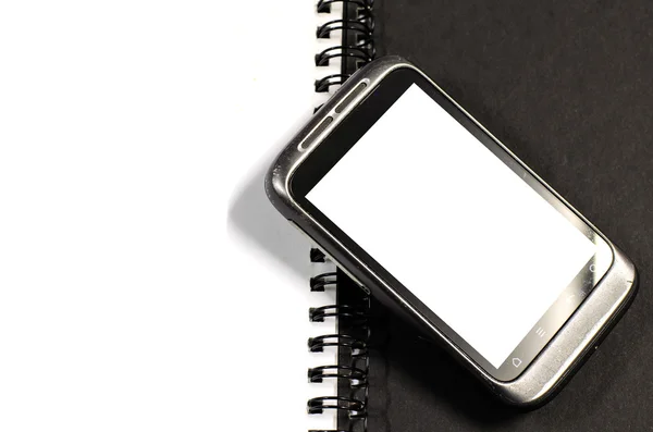 Smartphone no caderno. — Fotografia de Stock