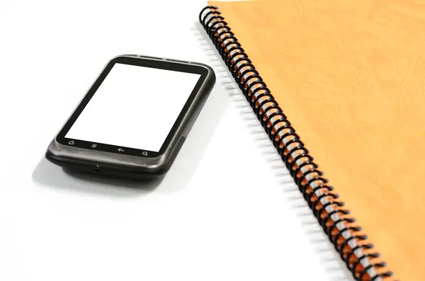 Smartphone avec carnet de notes — Photo