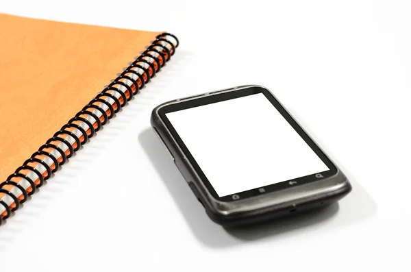 Smartphone avec carnet de notes — Photo