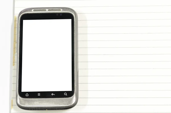 Smartphone com livro de notas — Fotografia de Stock