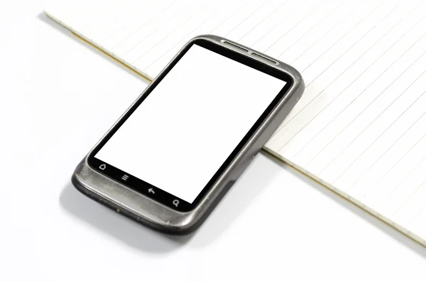 Смартфон с записной книгой — стоковое фото