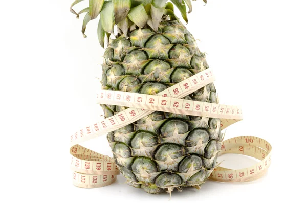 Pineapple with measuring tape — Stock Photo, Image