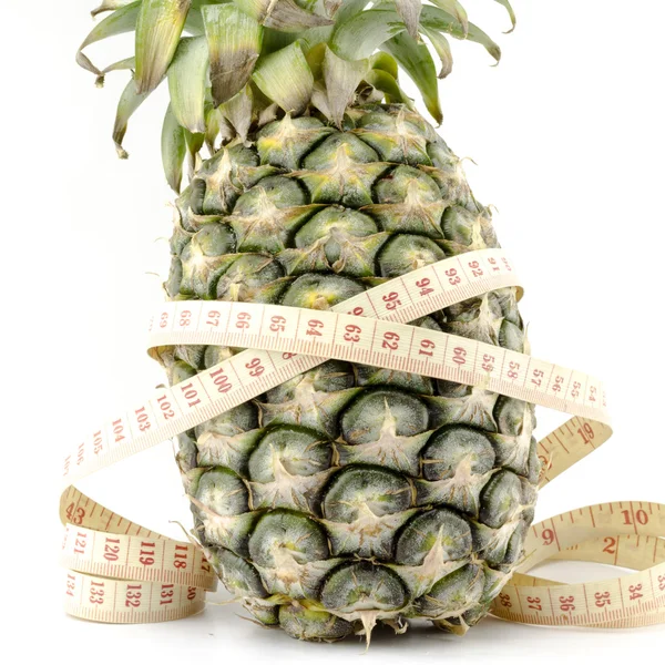 Pineapple with measuring tape — Stock Photo, Image