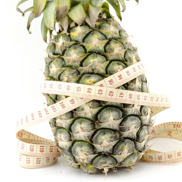 Pineapple with measuring tape — Stock Photo, Image