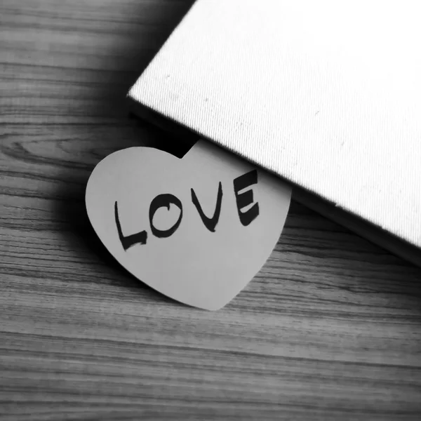 Black and white paper heart with notebook — Stock Photo, Image