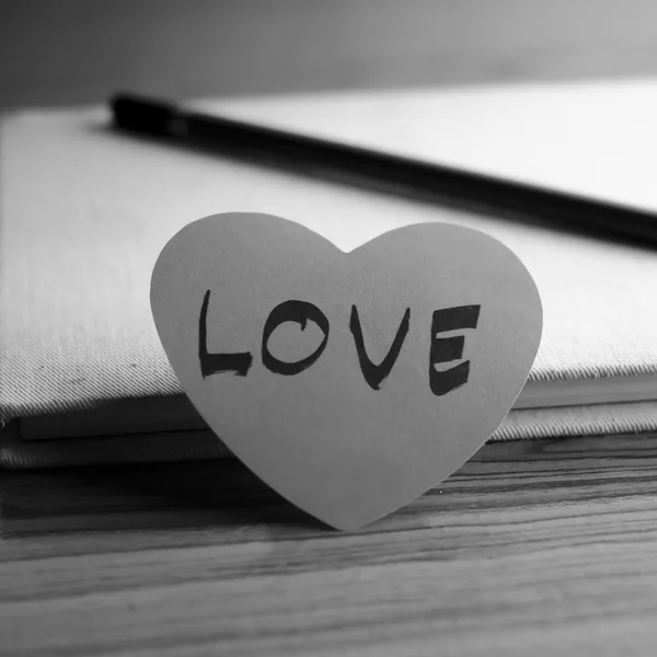 Black and white paper heart with notebook — Stock Photo, Image