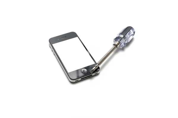 Black  smartphone with screwdriver — Stock Photo, Image