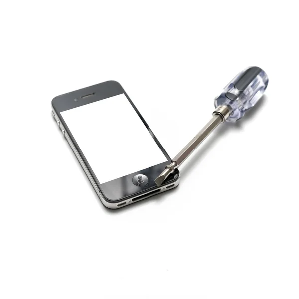 Black  smartphone with screwdriver — Stock Photo, Image