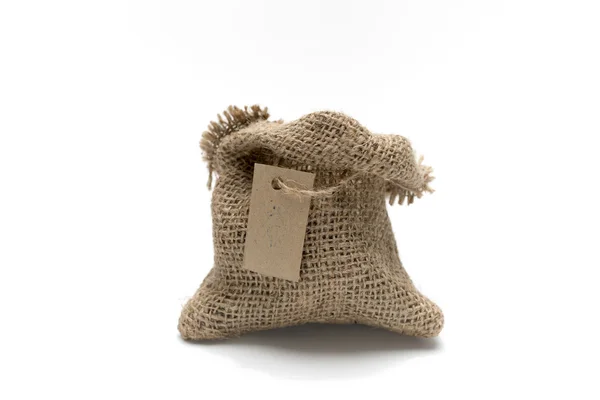 Empty burlap sack with tag — Stock Photo, Image